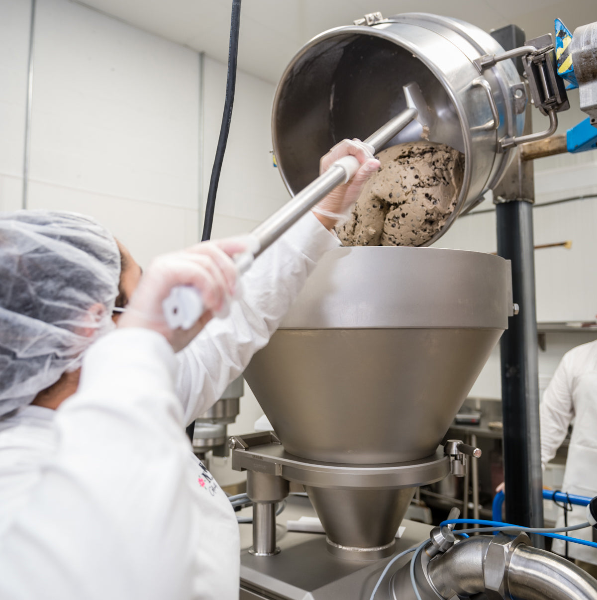 woman mixing chocolate chip cookie dough