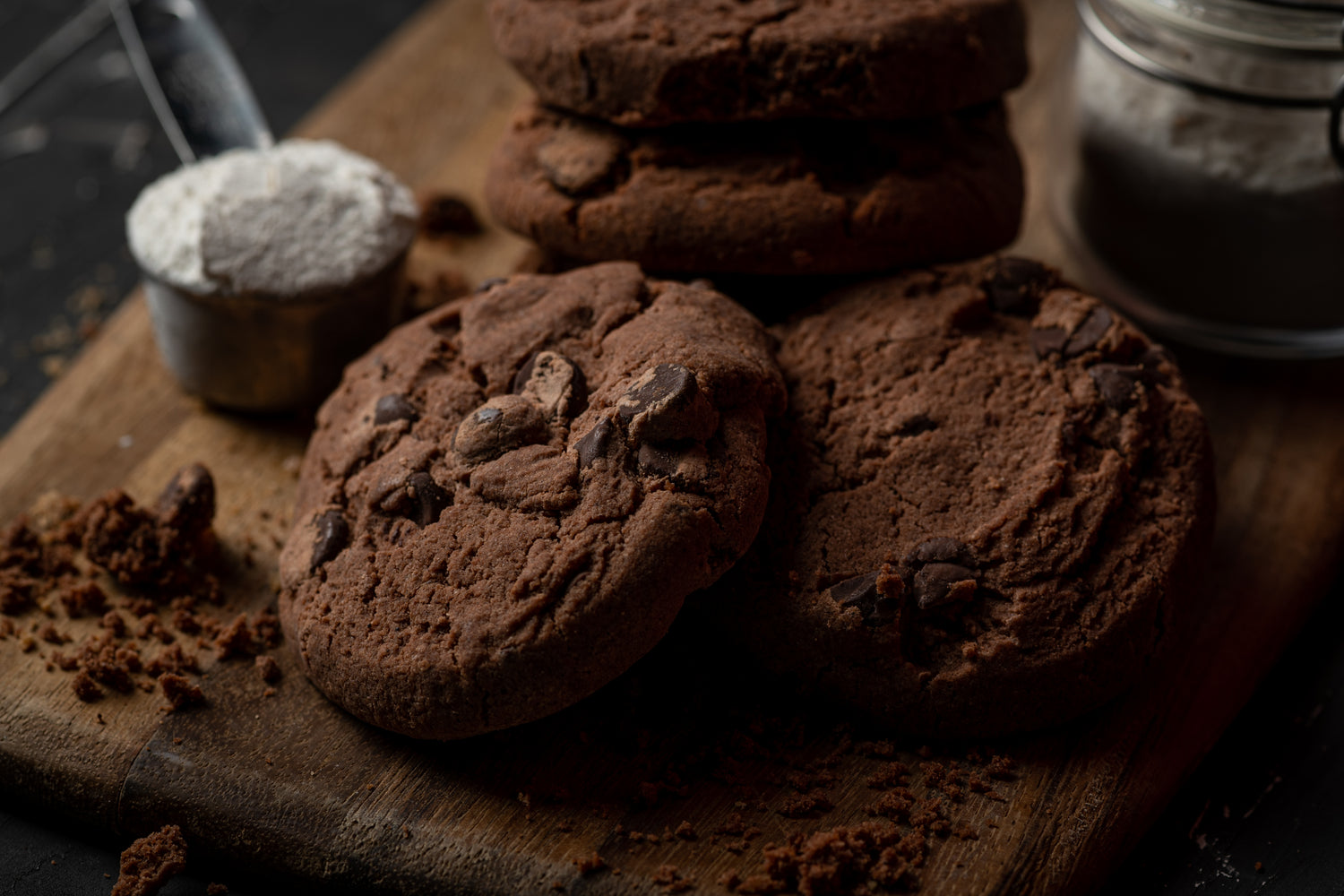 Choc-Choc-Chip Cookies on wooden board with ingredients